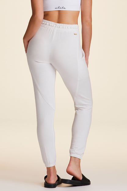 Back view of Alala Luxury Women's Athleisure super crewneck fleece sweatpant in white with pockets