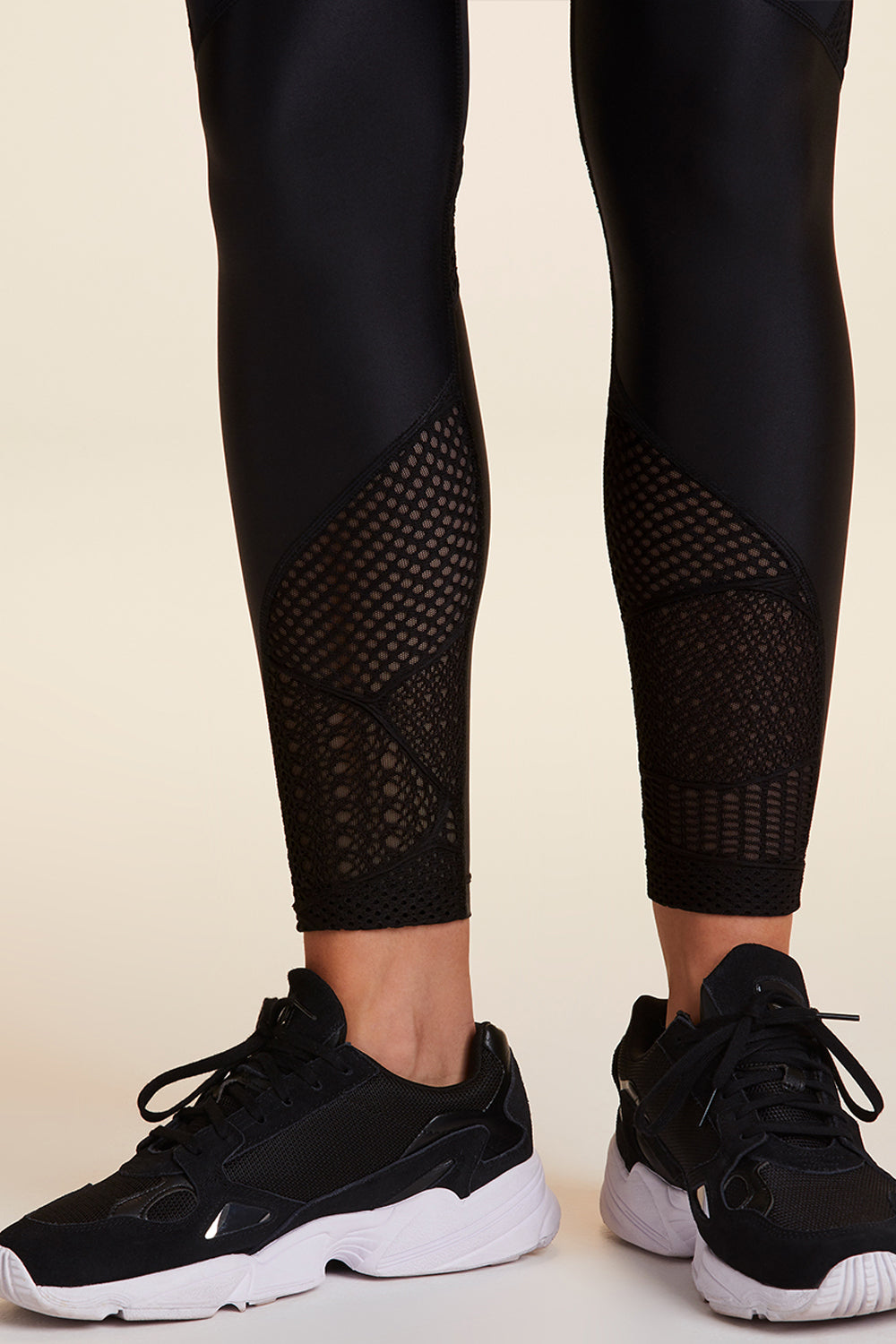 View of bottom leg detailing on Alala Luxury Women's Athleisure collage tight in black