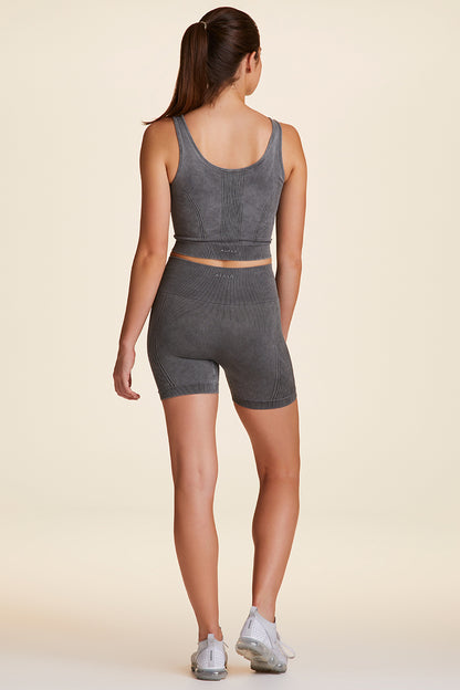 Full body back view of Alala Women's Luxury Athleisure barre seamless short in grey