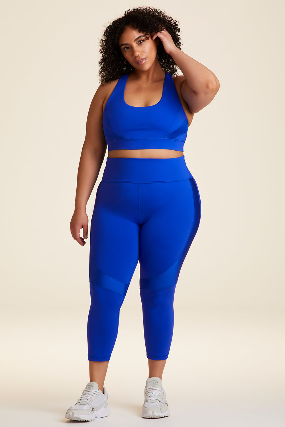 Front full body view of Alala Luxury Women's Athleisure vamp bra in cobalt blue with racerback fit in plus size
