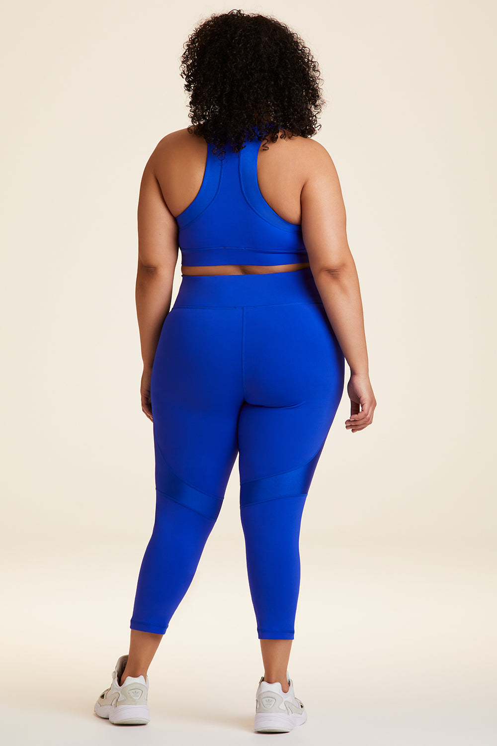 Back full body view of Alala Luxury Women's Athleisure vamp bra in cobalt blue with racerback fit in plus size