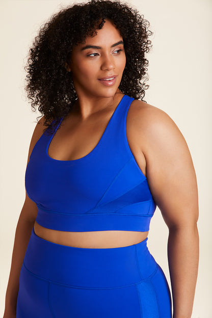 Front view of Alala Luxury Women's Athleisure vamp bra in cobalt blue with racerback fit in plus size