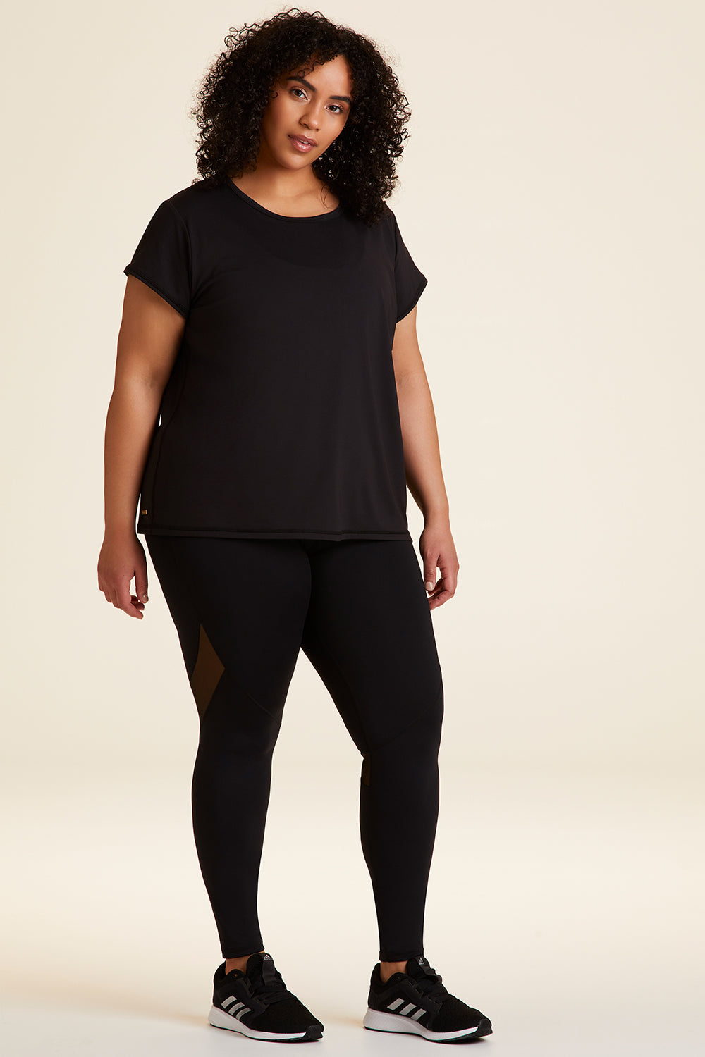Full body front view of Alala Women's Luxury Athleisure blade tee in black