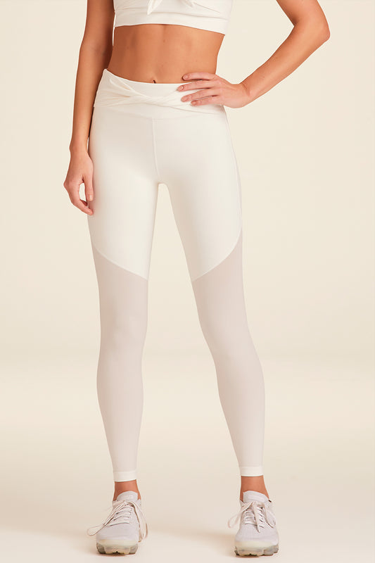 Front view of Alala Luxury Women's Athleisure tied bow tight in bone