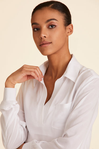Zoomed in view of collar of Alala Women's Luxury Athleisure lightweight woven pullover shirt in white