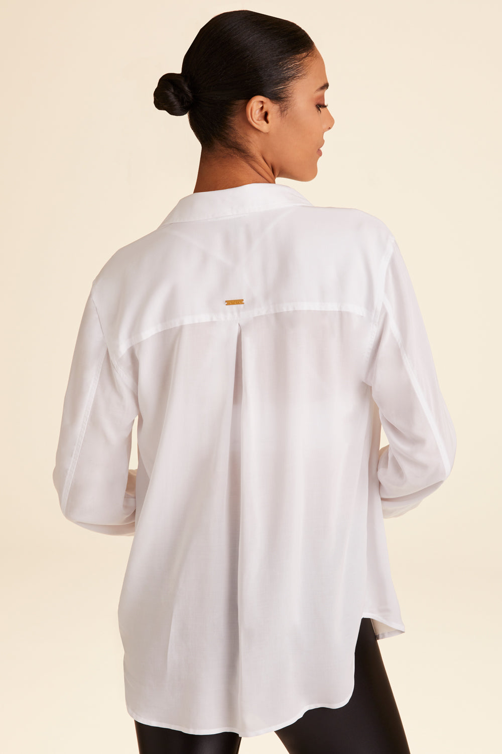 Back view of Alala Women's Luxury Athleisure lightweight woven pullover shirt in white