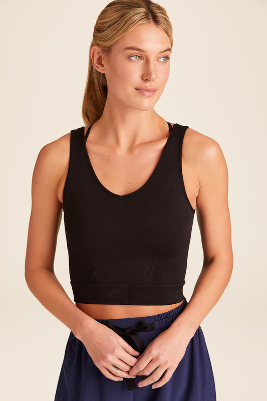 Front view of Alala Luxury Women's Athleisure seamless knit V-neck crop tank in black