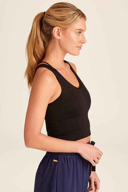 Side view of Alala Luxury Women's Athleisure seamless knit V-neck crop tank in black