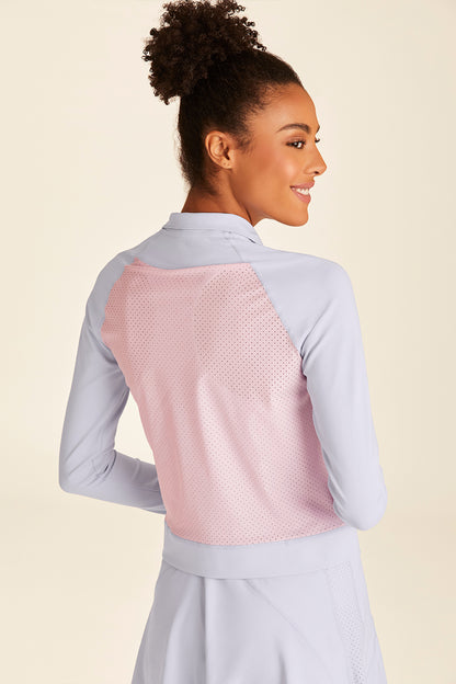 Back view of blue, pink, and white Alala Ace Jacket with breathable back detailing visible