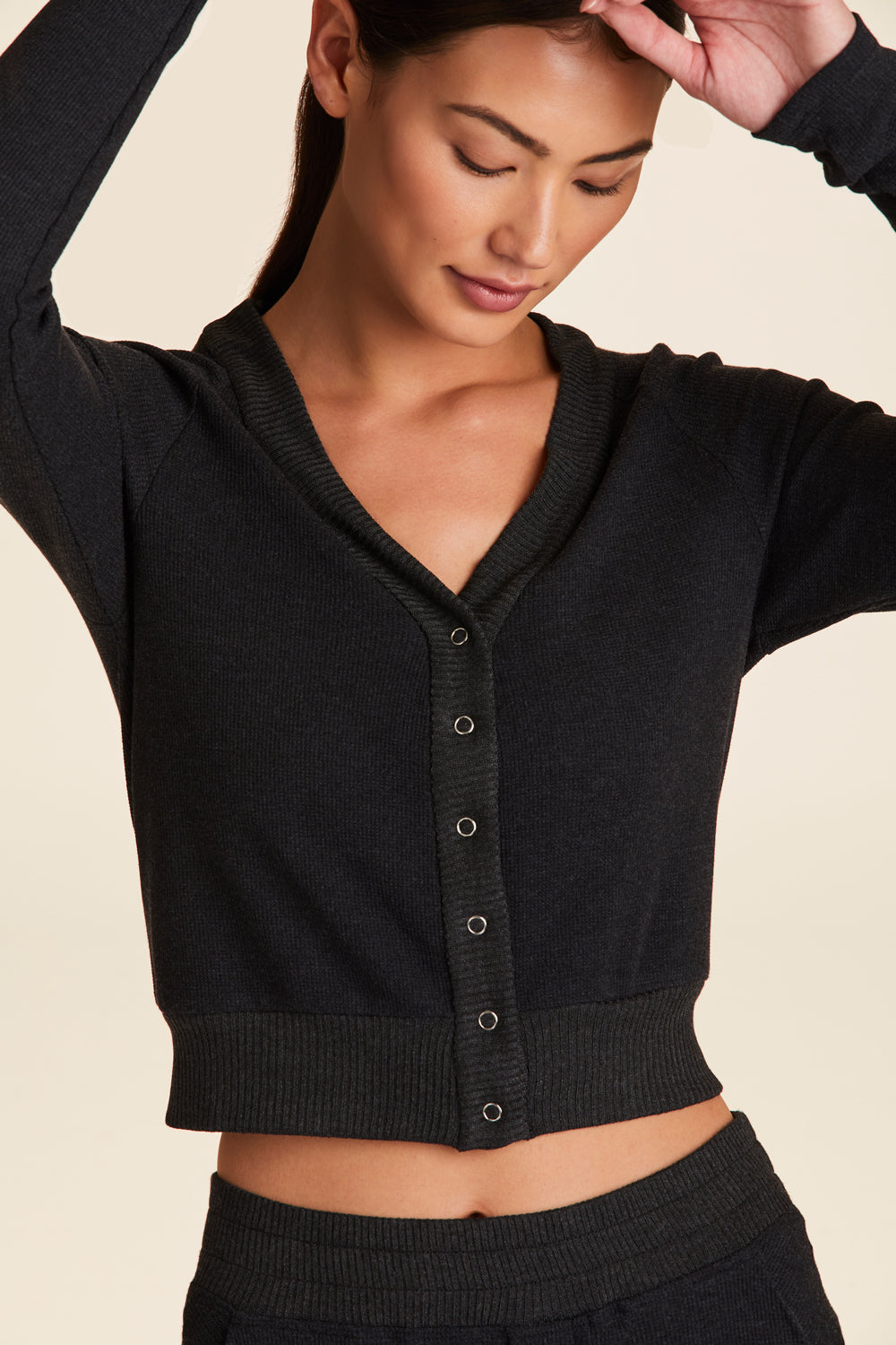 Front view of Alala Women's Luxury Athleisure thermal cardigan in charcoal