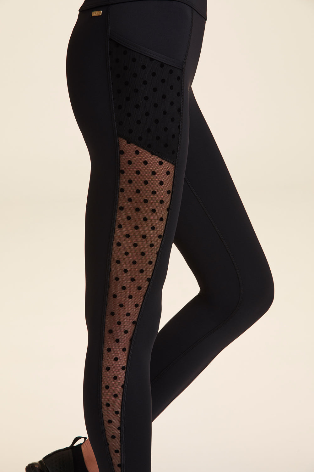 Black Lululemon leggings with dot mesh detail on back