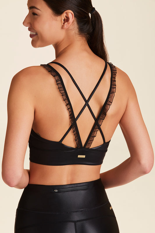 Back view of Alala Women's Luxury Athleisure ribbon bra in black liquid black with ribbon detailing on straps