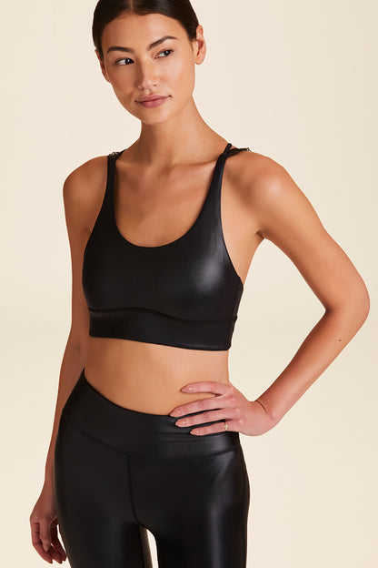 Front view of Alala Women's Luxury Athleisure ribbon bra in black liquid black with ribbon detailing on straps