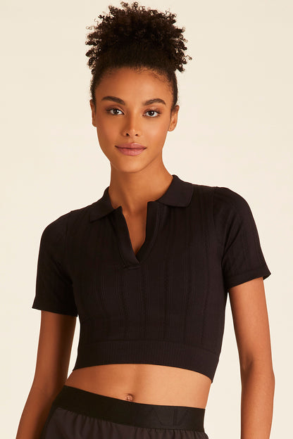Front closeup of model dressed in black Seamless Polo