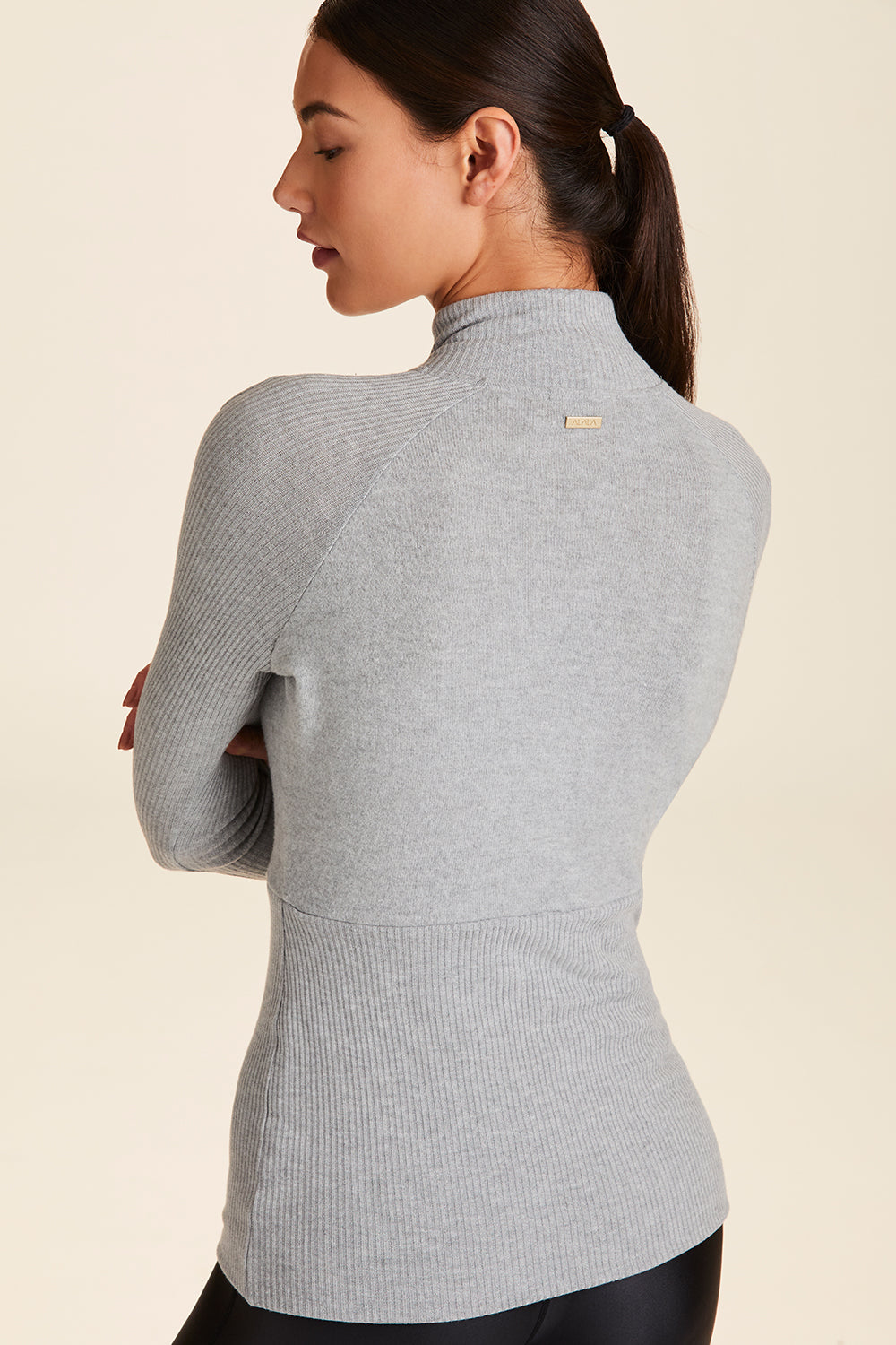 Back view of Alala Women's Luxury Athleisure super=soft quarter zip pullover