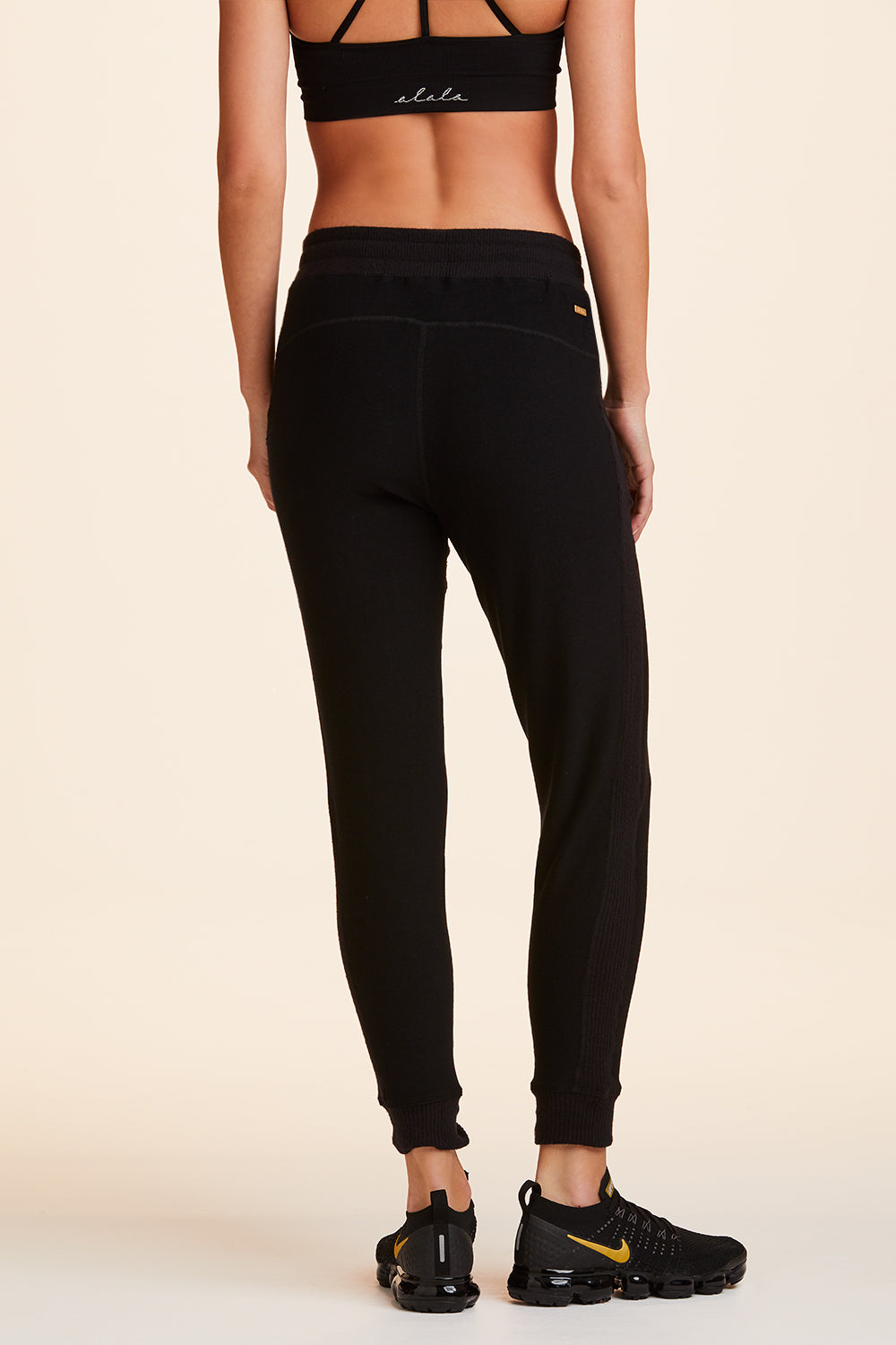 Back view of Alala Women's Luxury Athleisure black sweatpant