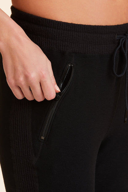 Close-up view of Alala Women's Luxury Athleisure black sweatpant