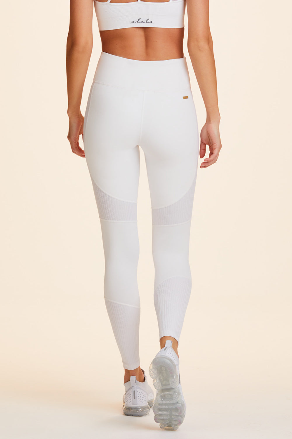 Back view of Alala Women's Luxury Athleisure white tight with rib detail