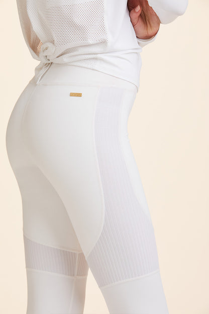 Side view of Alala Women's Luxury Athleisure white tight with rib detail