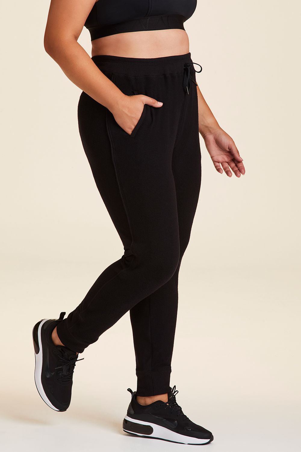 Side view of Alala Women's Luxury Athleisure wander sweatpant in black