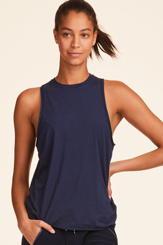 Front view of Alala Women's Luxury Athleisure navy tank with keyhole opening on back