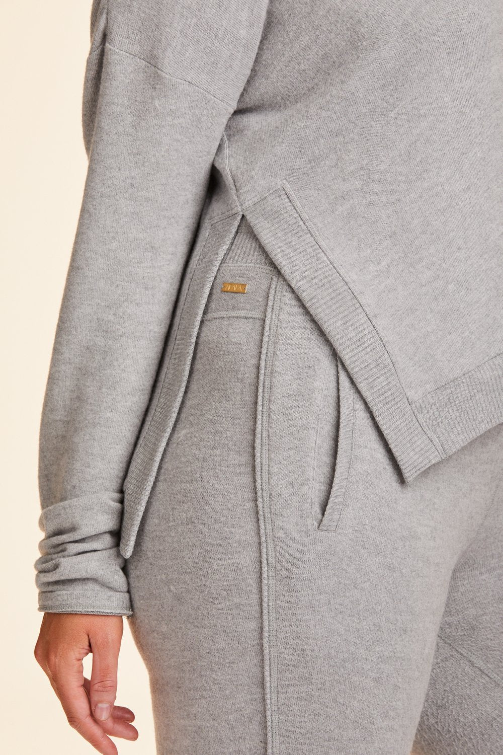 Close-up view of Alala Women's Luxury Athleisure super-soft grey sweatshirt