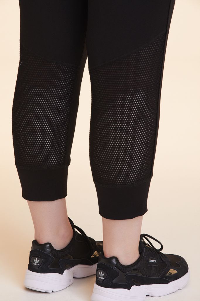 Close-up view of Alala Women's Luxury Athleisure black cropped jogger pant