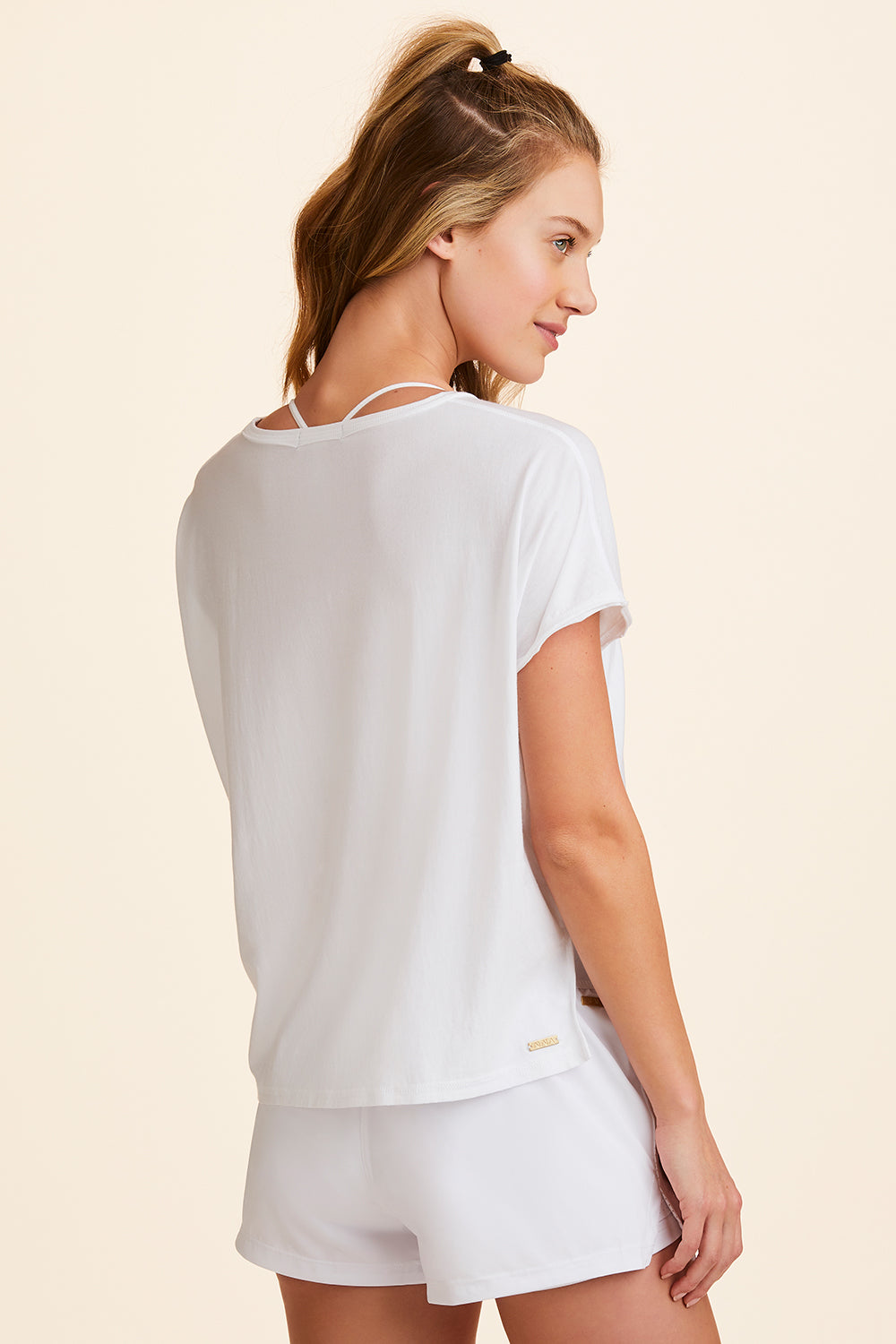 Back view of Alala Women's Luxury Athleisure super-soft tee in solid White