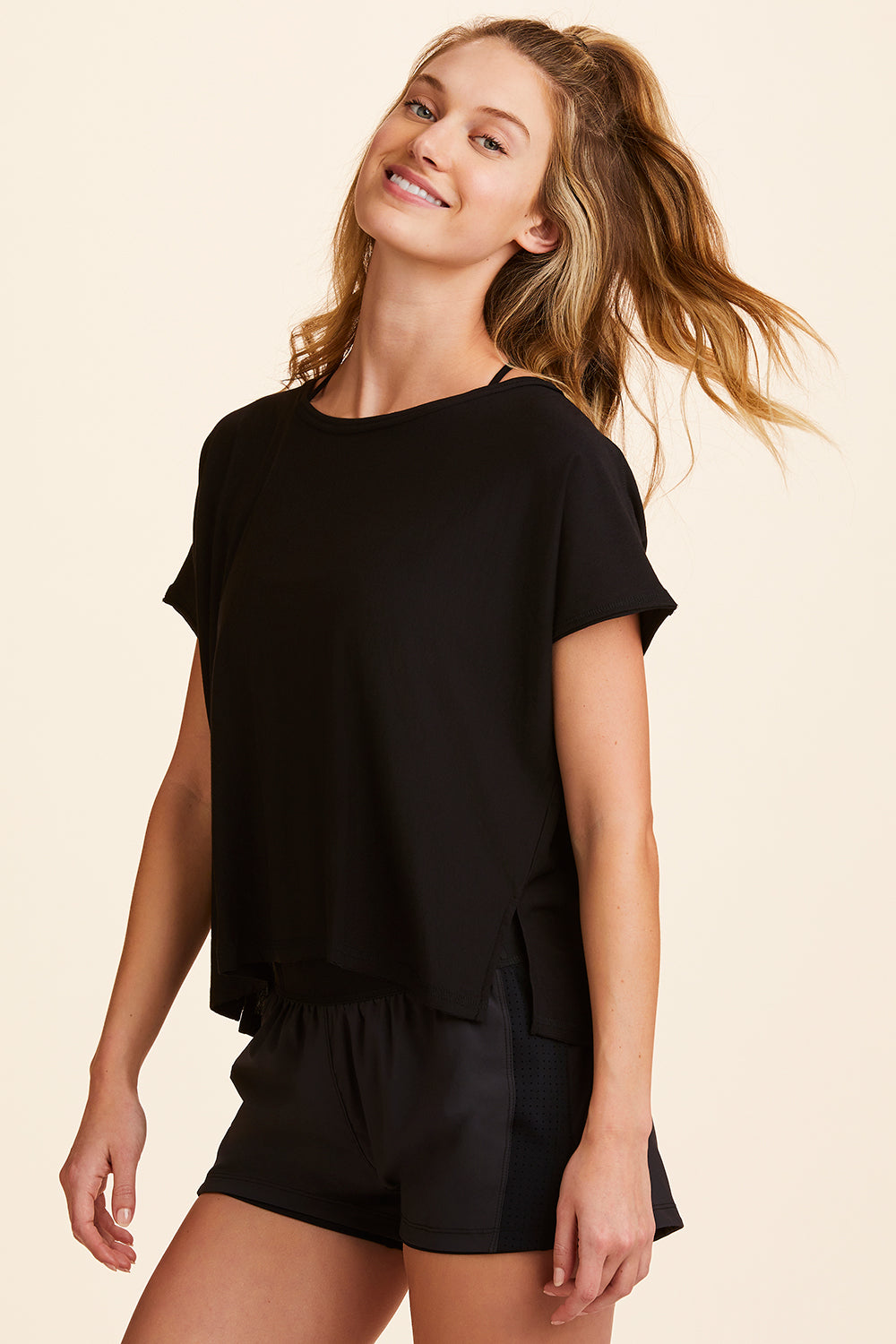 3/4 view of Alala Women's Luxury Athleisure super-soft tee in solid Black