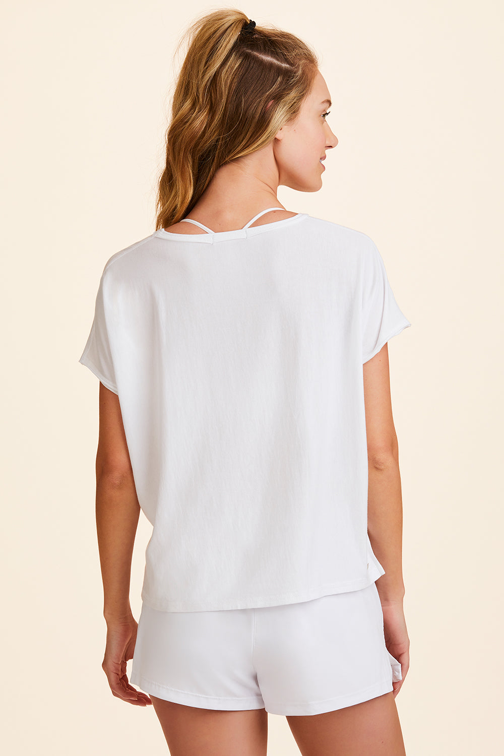 Back view of Alala Women's Luxury Athleisure super-soft tee in solid White