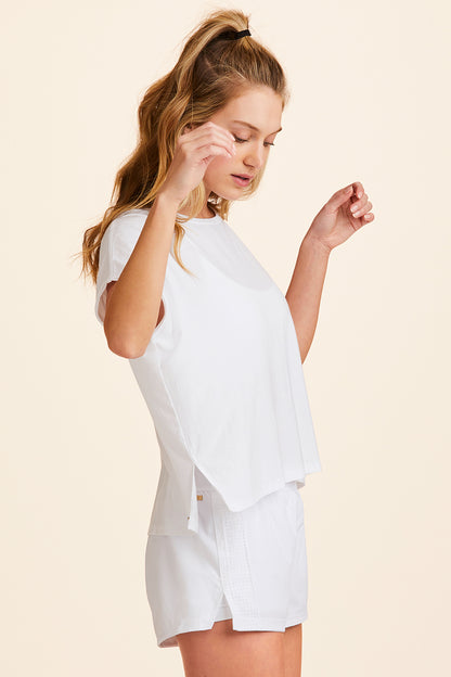 Side view of Alala Women's Luxury Athleisure super-soft tee in solid White