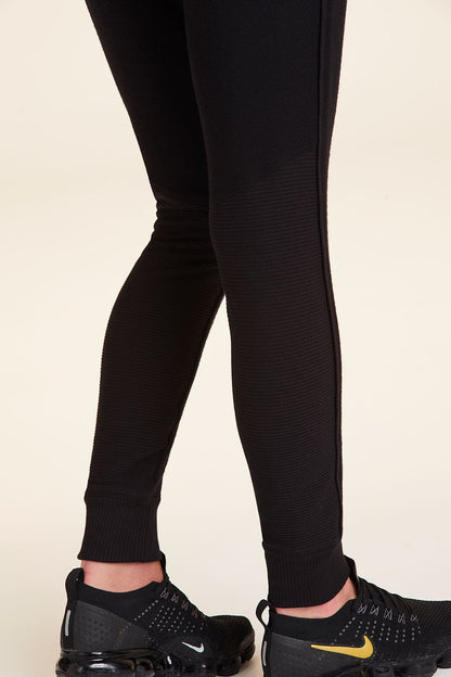 Zoomed in side view of Alala Women's Luxury Athleisure wander sweatpant in black