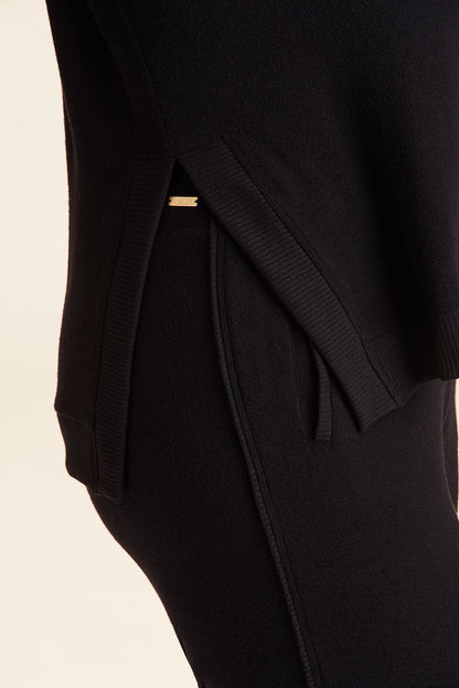 Zoomed in side view of Alala Women's Luxury Athleisure wander sweatshirt in black